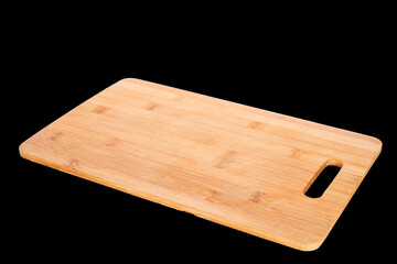 One bamboo cutting board, macro, isolated on a black background.