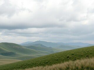 Rolling hills and grasslands under a grey cloudy sky, nature, open field, natural scenery