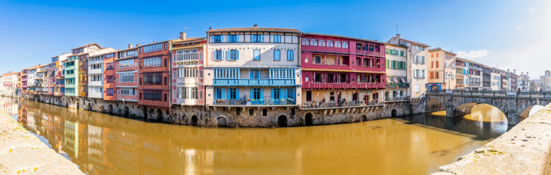 Facades of houses in the town of Castres on the Agout River in Occitanie, France