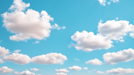 Fluffy white clouds against bright blue sky on a clear day