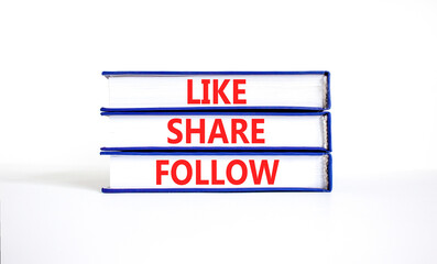 Like share follow symbol. Concept words Like Share Follow on beautiful blue white books. Beautiful...