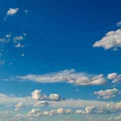 White fluffy clouds on blue sky.