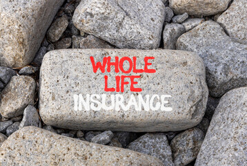 Whole life insurance symbol. Concept words Whole life insurance on beautiful grey stone. Beautiful...