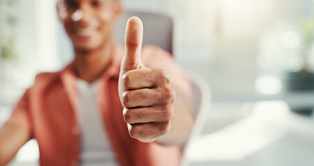 Man, hand and thumbs up in office, approval emoji and motivation for support or agreement. Male person, creative professional and thank you for promotion in workplace, goal feedback and opinion