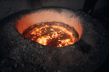 Molten metal glows intensely within a furnace's fiery heart