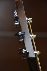 Black guitar with strings from close up
