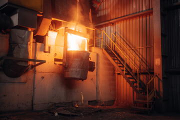 Molten metal is poured in an industrial foundry setting