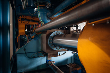 Industrial machinery close up showcasing intricate metal components and hydraulic systems