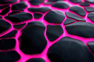 Abstract close-up of a dark, textured surface with vibrant pink glowing crevices.