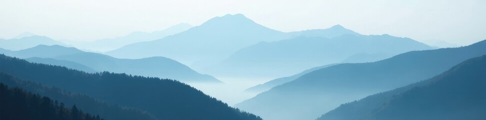 Obraz premium Majestic mountain range shrouded in thick fog, vast, quiet, misty