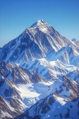 Obraz premium Snow-covered mountains under a clear blue sky