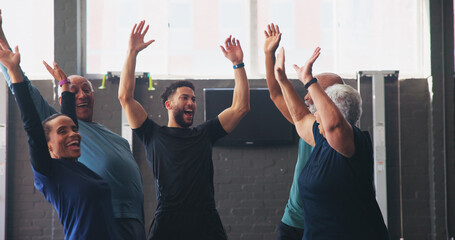 Mature people, personal trainer and celebration in gym class for exercise, workout or training. Physical therapy, support and goal with team building for fitness, coach and retirement health cardio