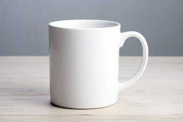 Fototapeta premium Blank White Ceramic Mug - Single Household Container for Coffee and Tea - Crockery Coffee Cup with Porcelain Finish