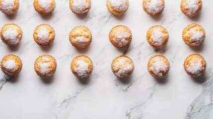 A flat-lay shot of sweet muffins paired with brown sugar, elegantly arranged on a white marble surface