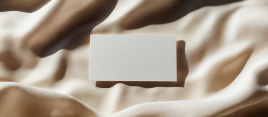 Obraz premium Blank Business Card Mockup on Beige Fabric, Elegant Branding