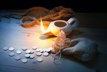 A loop made from old thick rope and coins