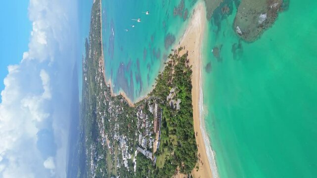Las Terrenas village vertical aerial with Punta Popy exquisit turquoise waters beach and underwater coral reefs. Tourism hot spot in the Dominican Republic, famous for kite surfing
