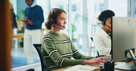 Business people, call center and woman with computer, telemarketing and employees in modern office. Person, help desk and consultant for insurance company, headset and online reading for client info