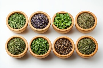 Variety of dried herbs and spices in wooden bowls arranged in a flat layout on a white surface