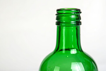 Close-up of a green bottle on a white background material focus studio environment artistic viewpoint