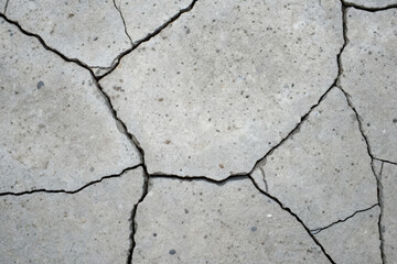 Cracked concrete surface material urban environment close-up view structural integrity texture analysis