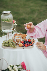 a table with fresh fruit in the park