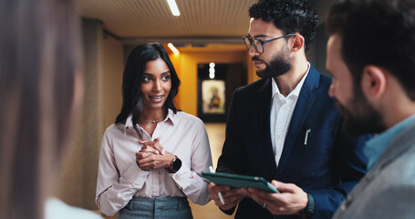 Conference, lobby and business people with tablet for feedback, schedule discussion or hotel hall...