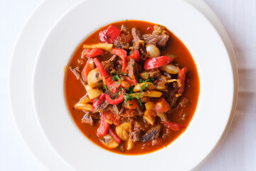 Hearty stew with tender meat and colorful vegetables