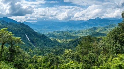 Fototapeta premium Lush green mountain valley waterfall landscape, scenic view