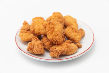 Fried chicken wings on a plate on a white background, close-up