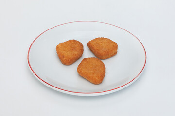 GeneraFried chicken wings on a plate on a white background  close-upted image