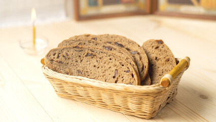 Wooden basket with non -crust bread on a wooden table, the concept of lean food during the Great Orthodox Post.