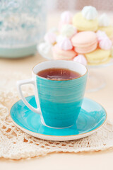 A blue cup on the table.