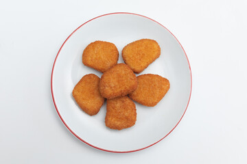 GeneraFried chicken wings on a plate on a white background  close-upted image
