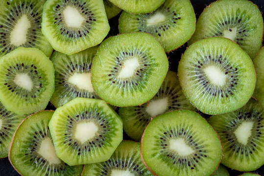 Fresh kiwi slices showcasing vibrant green texture