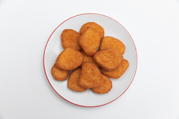 GeneraFried chicken wings on a plate on a white background  close-upted image