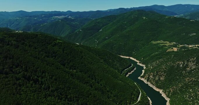Vast River Basin Flowing Through Forest Covered Mountain Range Meandre Turns Aerial Parallax Reveal