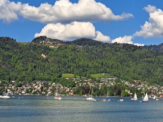 A lake in the Swiss Alps. The Blue Lake in Switzerland. Snow-capped mountains near the lake. Spring.