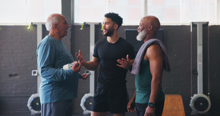Mature men, personal trainer and friends in gym for exercise, workout or training discussion....