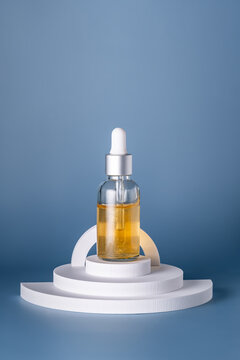Elegant cosmetic oil bottle on a circular podium
