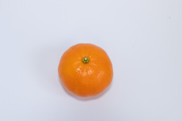 Fresh ripe tangerines with leaves on white background
