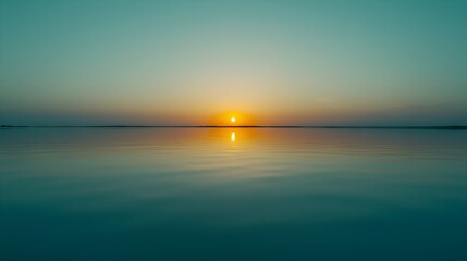 Obraz premium This landscape photo captures a tranquil sunset and is characterized by its minimalistic, peaceful and expansive landscape.