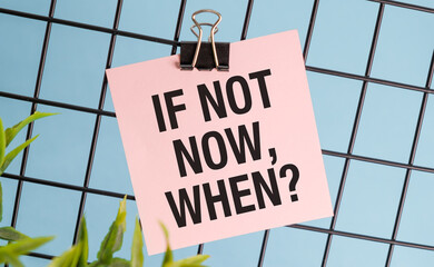 If not now, when inscription on a pink sticker with a clip on a blue background