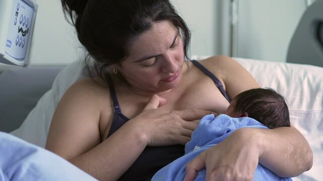 Big brother leaning on hospital bed, watching mother in pain, capturing the difficulties and emotional intensity of early motherhood in a hospital environment