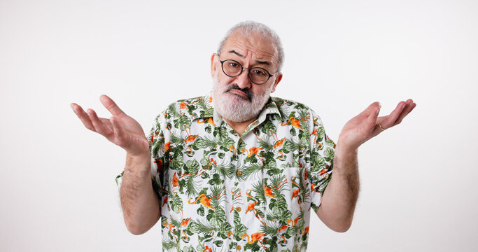 Portrait, confused and old man in studio, clueless and facial expression on white background. Face, mature person and model with hand gesture, questions and why with doubt, raise arms and thinking