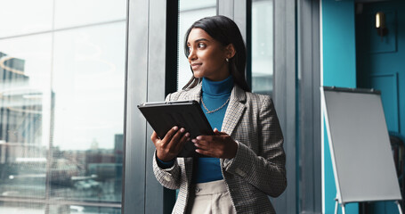 Thinking, tablet and window with business woman in office for workshop coordinator, reflection and corporate trainer. Vision, planning and conference organizer with person in agency for schedule