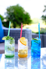Refreshing summer drinks in colorful glasses