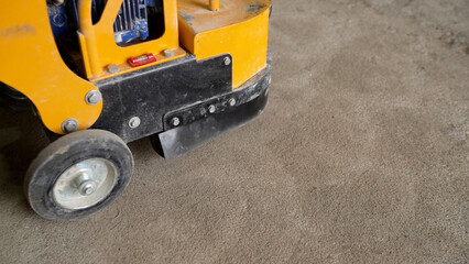 Obraz premium Concrete surface grinding machine smoothing industrial floor