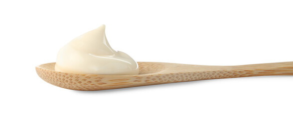 Tasty mayonnaise sauce in wooden spoon isolated on white