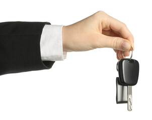Woman with car key and keychain on white background, closeup